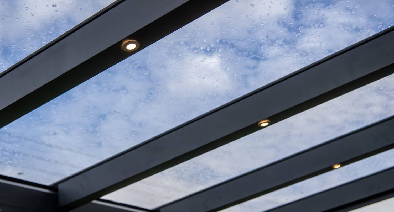 Close up of a glass veranda roof with integrated LED spotlights