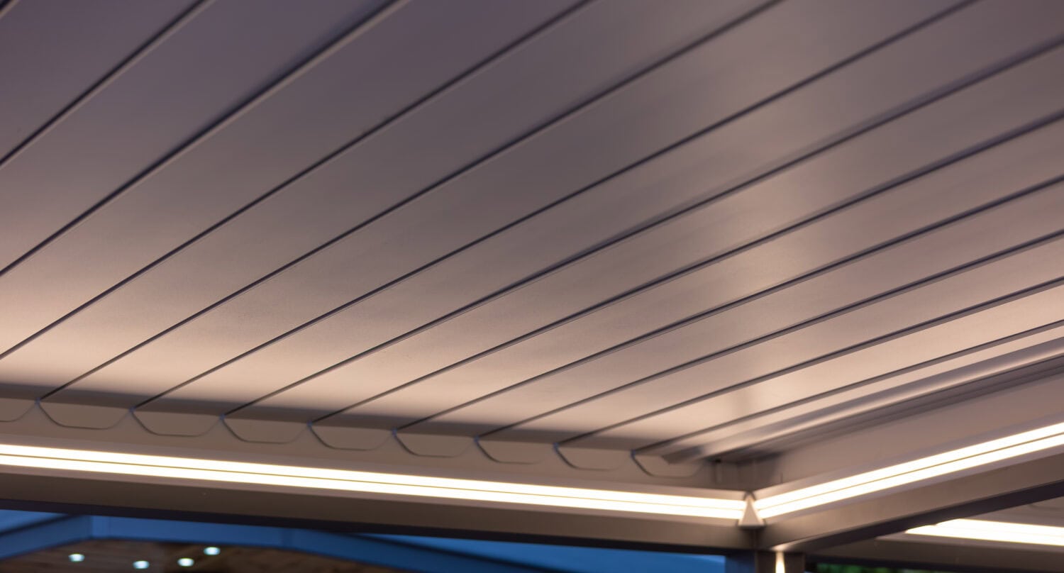 Close-up of adjustable aluminium louvre roof slats with integrated LED lighting strips